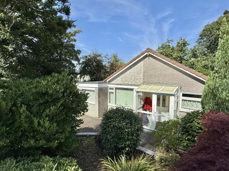 Private frontage from mature shrubs