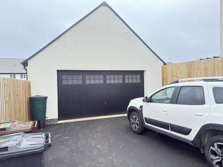Double Garage + Parking for 2 Cars on driveway