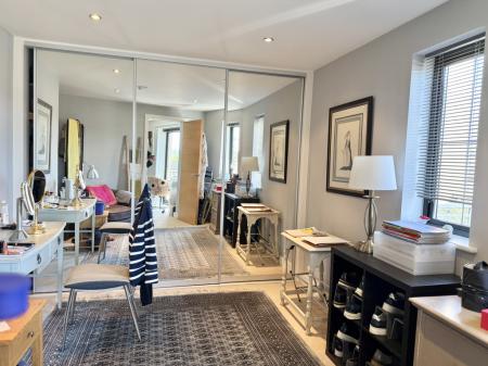 Double bedroom with triple wardrobes