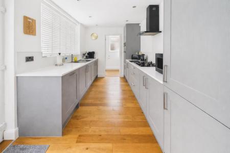 Modern galley kitchen with sleek design.png