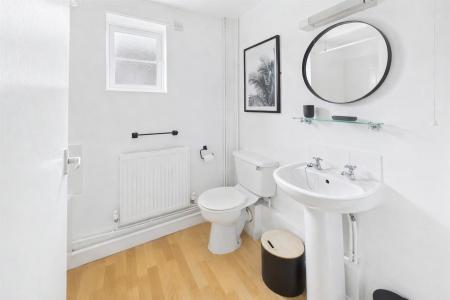 Modern bathroom with sleek contrasts.png