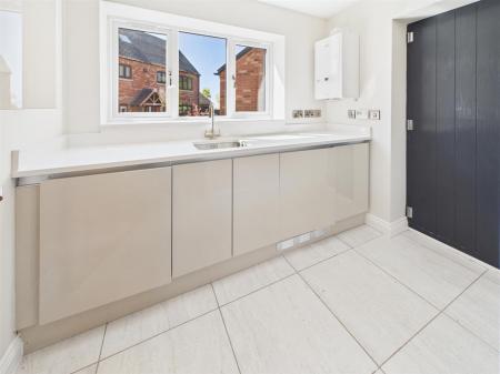 Utility Room With Storage & Appliances
