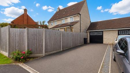 Rear and driveway