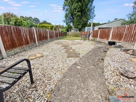 Rear garden with outbuildings