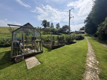 green house and veg beds.jpeg