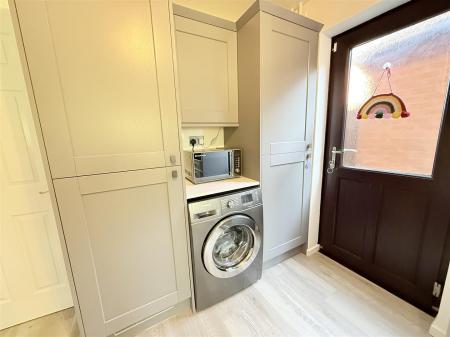 Fitted Kitchen With Utility Area