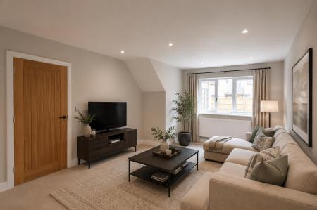 Plots 1, 2, 9 & 10 - Staged living room.png