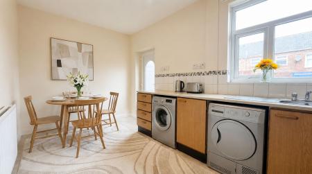Kitchen - This image has been virtually staged using AI to show potential layout and furnishings