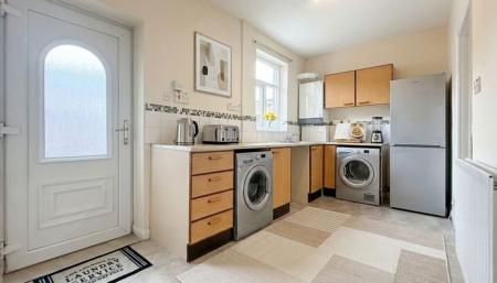 Kitchen - This image has been virtually staged using AI to show potential layout and furnishings