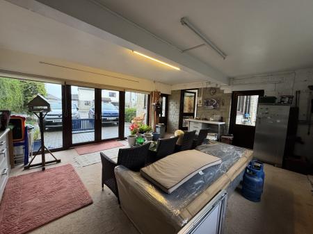 STORE/PREVOUSLY DOUBLE GARAGE TO KITCHEN DOOR