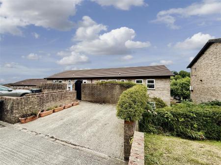 Parkign Area Towards Property.JPG